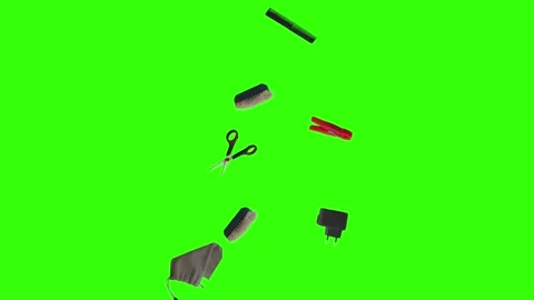 Collection of everyday objects falling against a green screen background Stock Footage 340387156