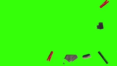 Collection of everyday objects falling against a green screen background Stock Footage 340387163