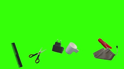 Collection of everyday objects falling against a green screen background Stock Footage 340387170
