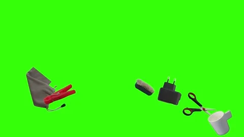 Collection of everyday objects falling against a green screen background Stock Footage 340387172