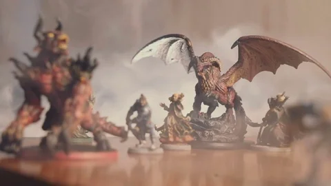 Collection of fantasy roleplay figures on table, smoke in swirling Video stock 79437557