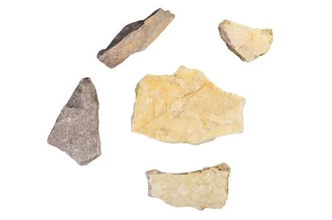 Collection of five rough, natural stone fragments on a white background Стоковые фото