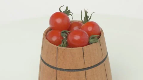 A collection of Fresh Cherry Tomatoes arranged beautifully in a rustic Wooden Видео 287826438
