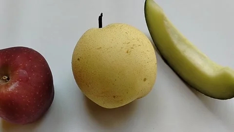 Collection of fresh pear, apple, and melon isolated on a simple background.  Stock Footage 337913574