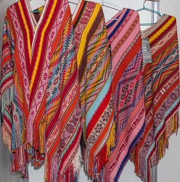 Collection of handmade Peruvian alpaca wool ponchos Stock Photos