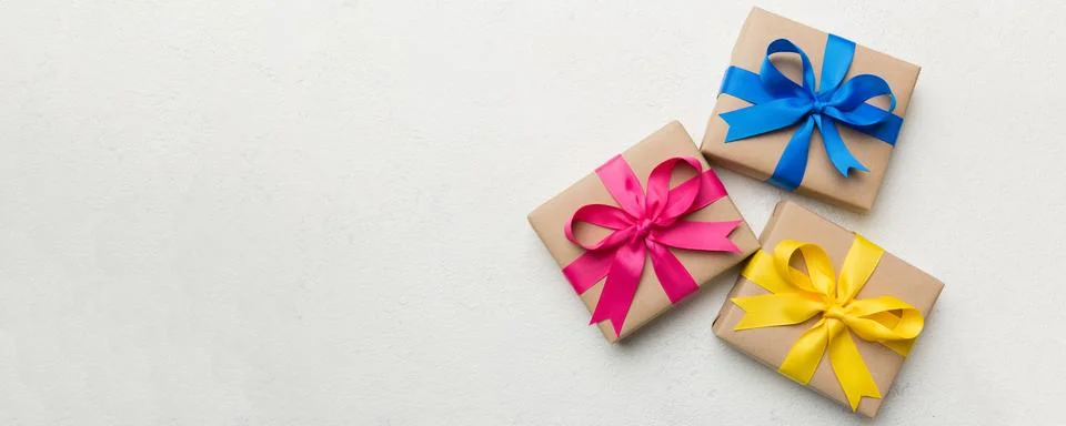 Collection of Holiday present boxes on a colored background. top view close u Stock Photos