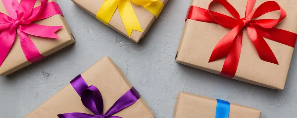 Collection of Holiday present boxes on a colored background. top view close u Stock Photos