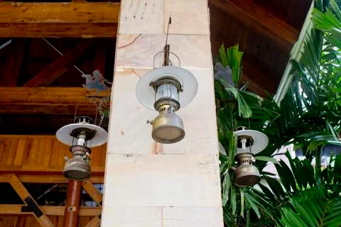 Collection of Lantern hanging on hook on marble pillar Stock Photos