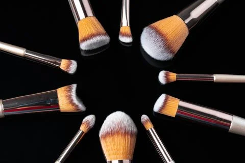 Collection of make up brushes on black background Stock Photos
