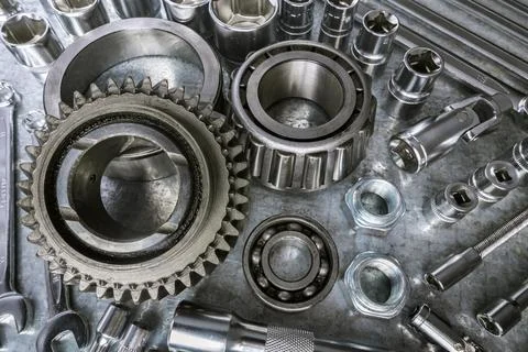 Collection of metallic tools and components on a workbench ready for mechanical Stock Photos