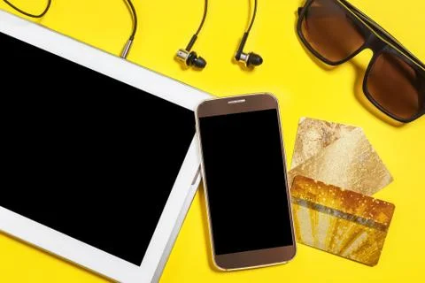 Collection of modern devices on a yellow background Stock Photos