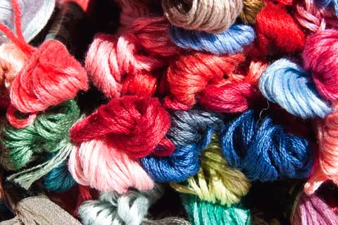 Collection of multi colored skeins of embroidery cotton Stock Photos