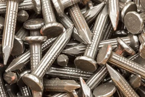 A collection of nails close up for use as a background. Stock Photos