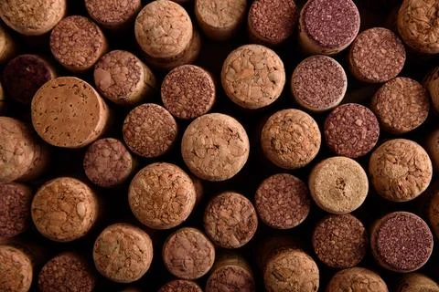 Collection of natural corks creating a textured wine background Stock Photos