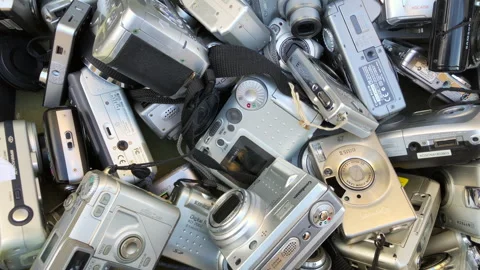 A collection of old digital compact cameras. Static shot. Stock Footage 269401313