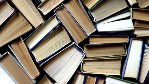 A collection of old hardcover books in the library. Stock Footage 200974308