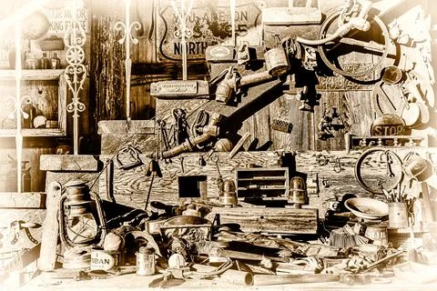 A collection of old tools and items are displayed in a cluttered manner Stock Illustration
