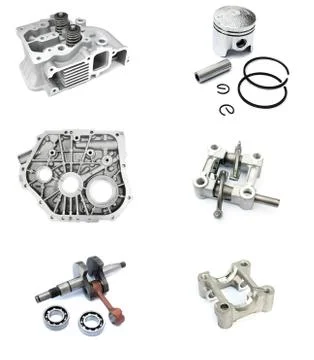 Collection precision auto engine parts laid out in a workshop Stock Photos