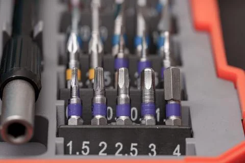 Collection of precision screwdriver bits organized in a tool kit for variou.. Stock Photos