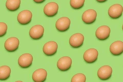 Collection of random color pattern eggs on green background. Happy Easter. Stock Photos