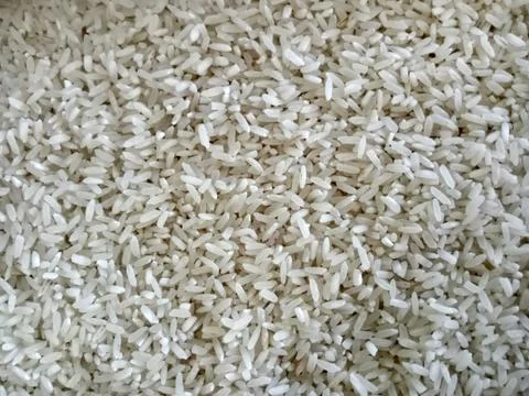 A collection of raw rice that will be cooked into cooked rice Stock Photos