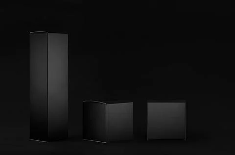Collection of rectangle tall, square black paper boxes, front, side view on b Foto stock