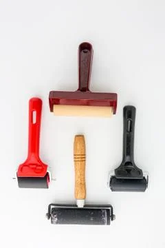 Collection of rubber brayers use in craft process on white background in top  Stock Photos