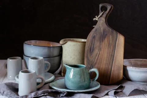 Collection of rustic simple handcraft kitchenware in neutral tones on grey Foto stock