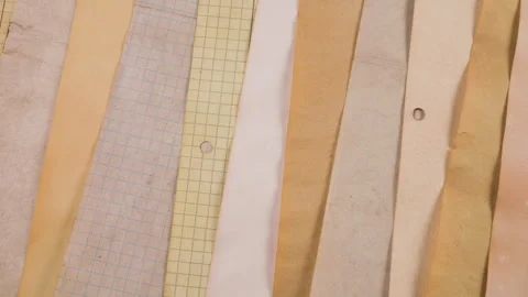 A collection of scrapbooking sheets features a variety of natural materials. Stock-Footage 329728389