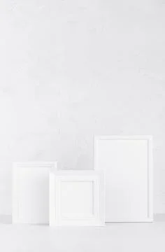 Collection of simple modern different white wood blank photo frames on wood b Stock Photos