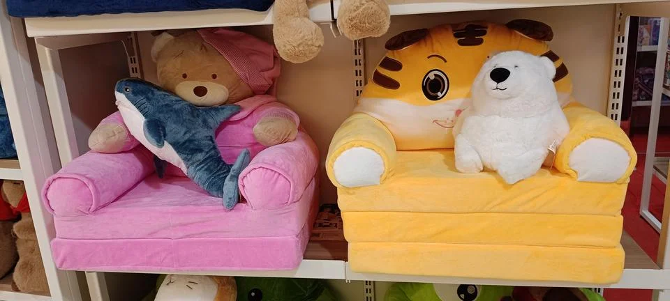 Collection of soft colored tissue boxes on a shelf Stock Photos