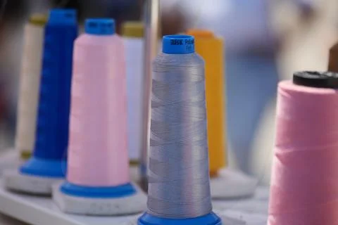 Collection of spools of thread in a craft market setting Foto stock
