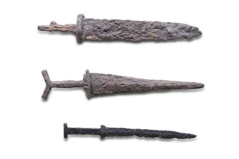 Collection of three antique metal objects, possibly tools or weapons, arran.. Foto stock