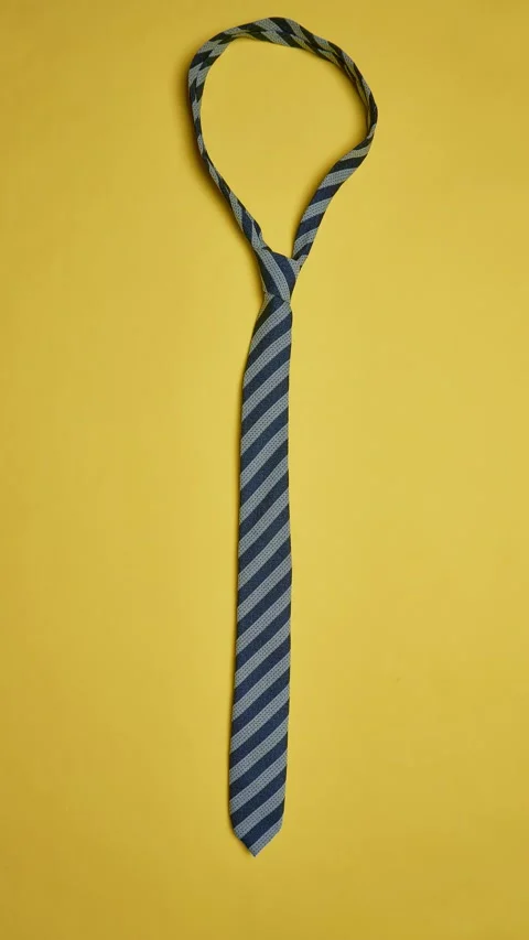 A collection of ties on a yellow background Stock Footage 321882655