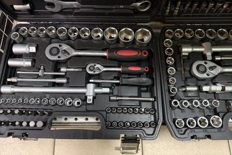 A collection of tools is organized in a tool kit on a workbench. Sockets and  Stock Photos
