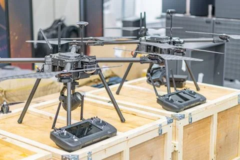 Collection of Ukrainian fpv drones in a large crate with open sides, arranged Stock Photos
