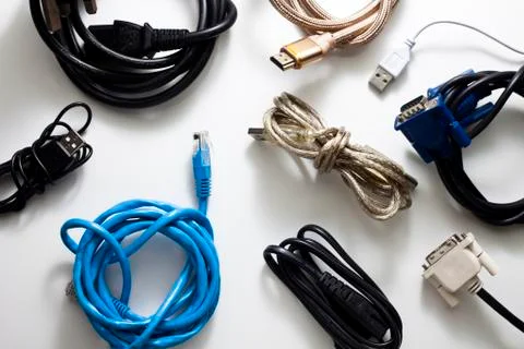 A Collection of Used Computer Cables on white Table Stock Photos