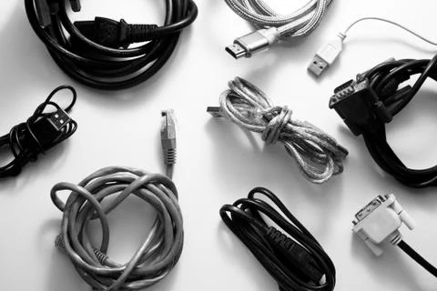 A Collection of Used Computer Cables on white Table Stock Photos