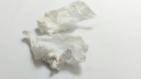 A collection of used tissues on a white background Видео 313418615