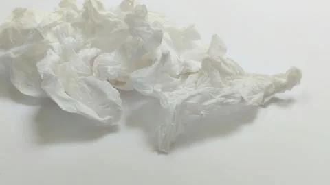 A collection of used tissues on a white background Видео 313418616