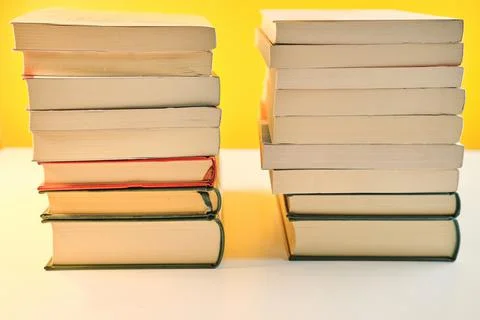 Collection of various Book stack in the library room on yellow background Fotos Stock