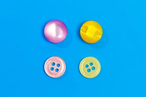 Collection of various colored buttons on colored background - Image Stock Photos