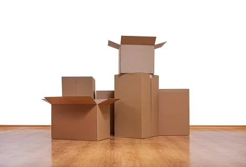 A collection of various sized brown cardboard boxes against a white background. Stock Photos