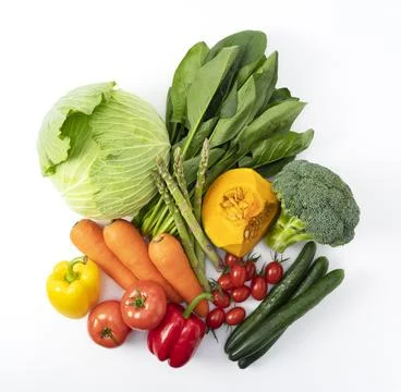 A collection of various vegetables placed on a white background Stock Photos