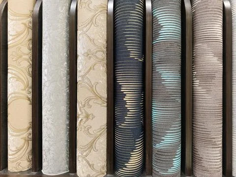 A collection of wallpaper rolls with unique patterns and colors, perfect fo.. Fotos Stock