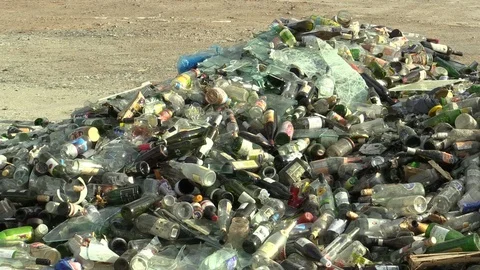 Collection yard for waste sorting, pile of white and colored glass bottles Stock Footage 90188391