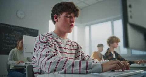 In College Classroom, Brown Haired Guy Doing Practical Task in Game Development Stock Footage 318524234