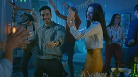 people dancing at a house party