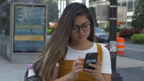 College Student with Backpack in City Texts Parents Stock Footage 114708901