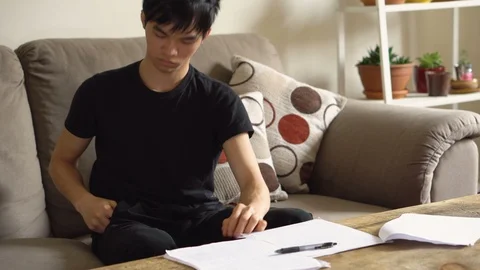 College Student Distracted By Smartphone While Trying To Study - Phone Addiction Stock Footage 121197960